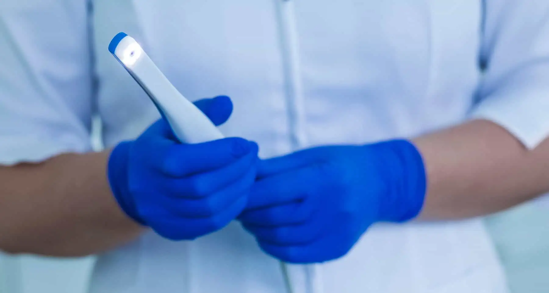 Intraoral camera showing tooth on a screen